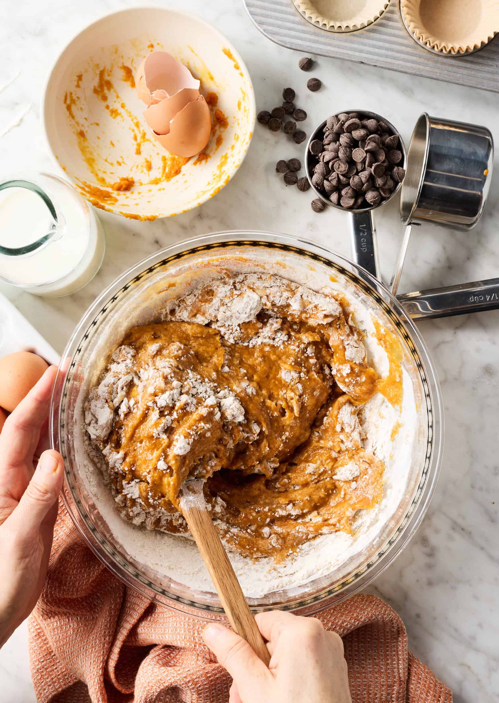 Combining wet and dry ingredients in mixing bowl