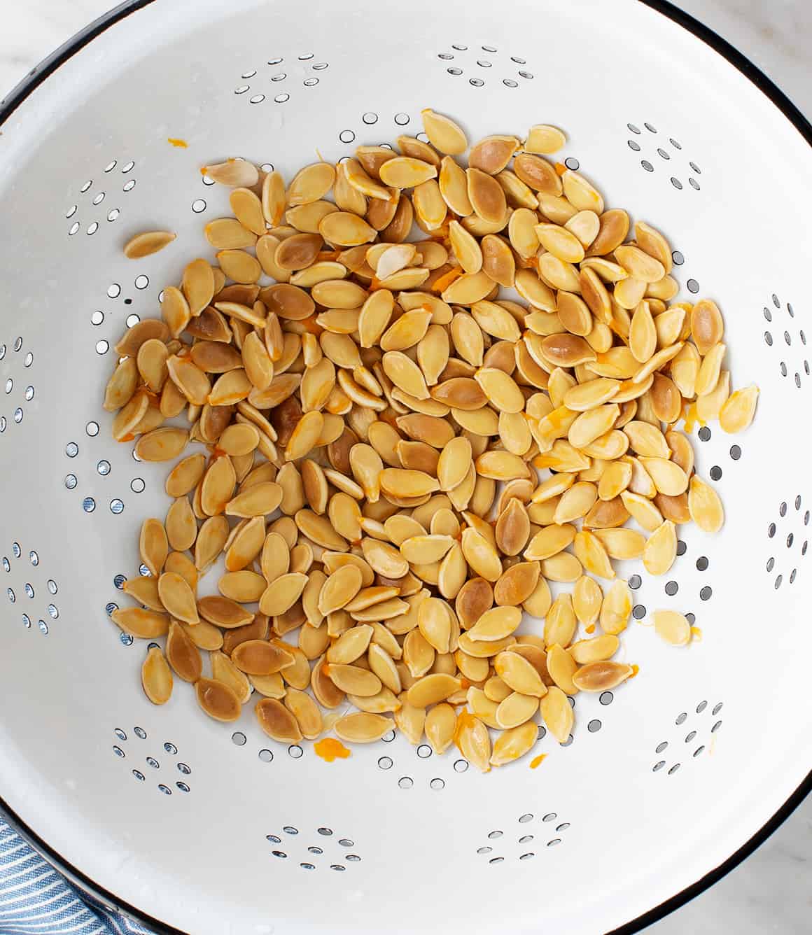 Rinsed seeds in a colander