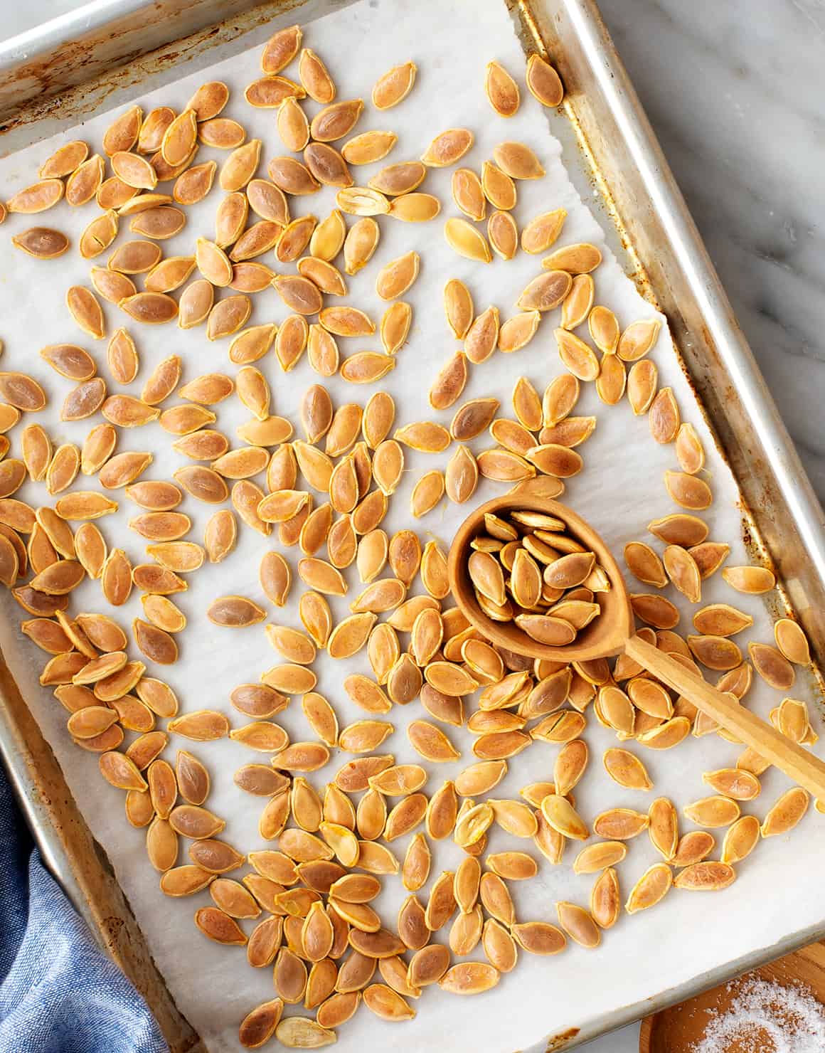 Roasted pumpkin seeds on a baking sheet