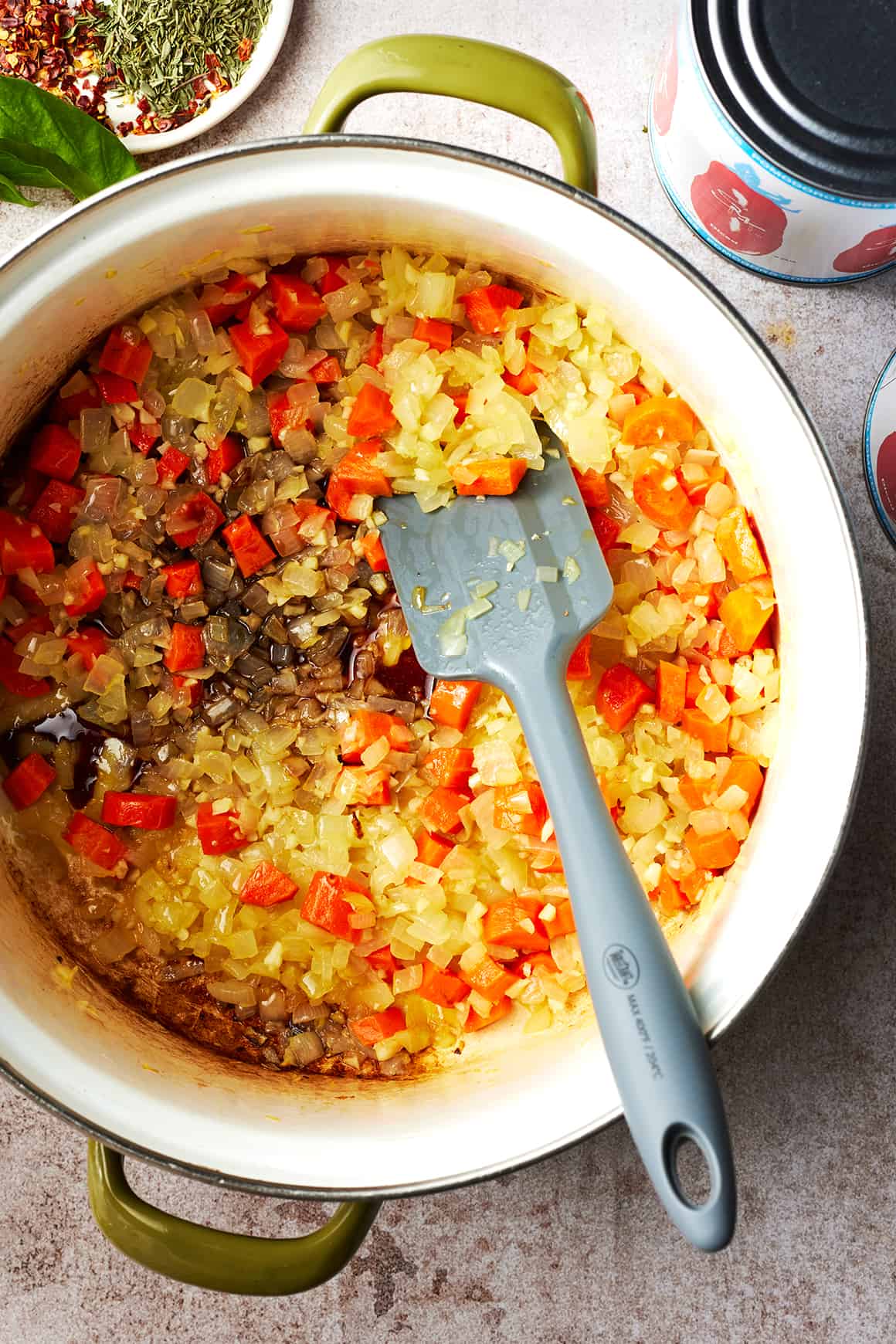 Sauteed carrots, onion, and garlic in a pot with balsamic vinegar