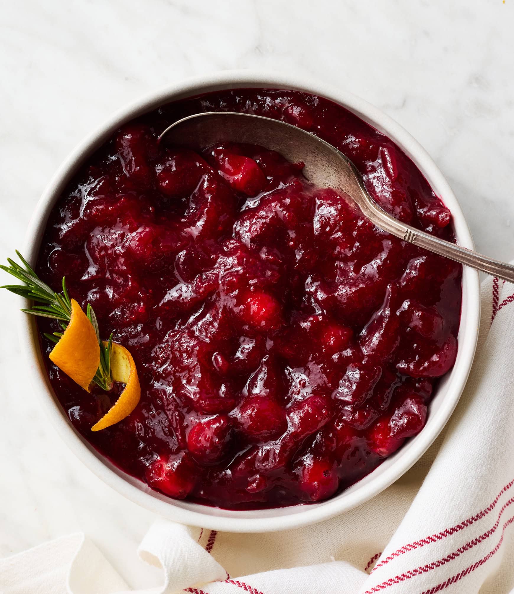 Cranberry sauce in bowl with spoon