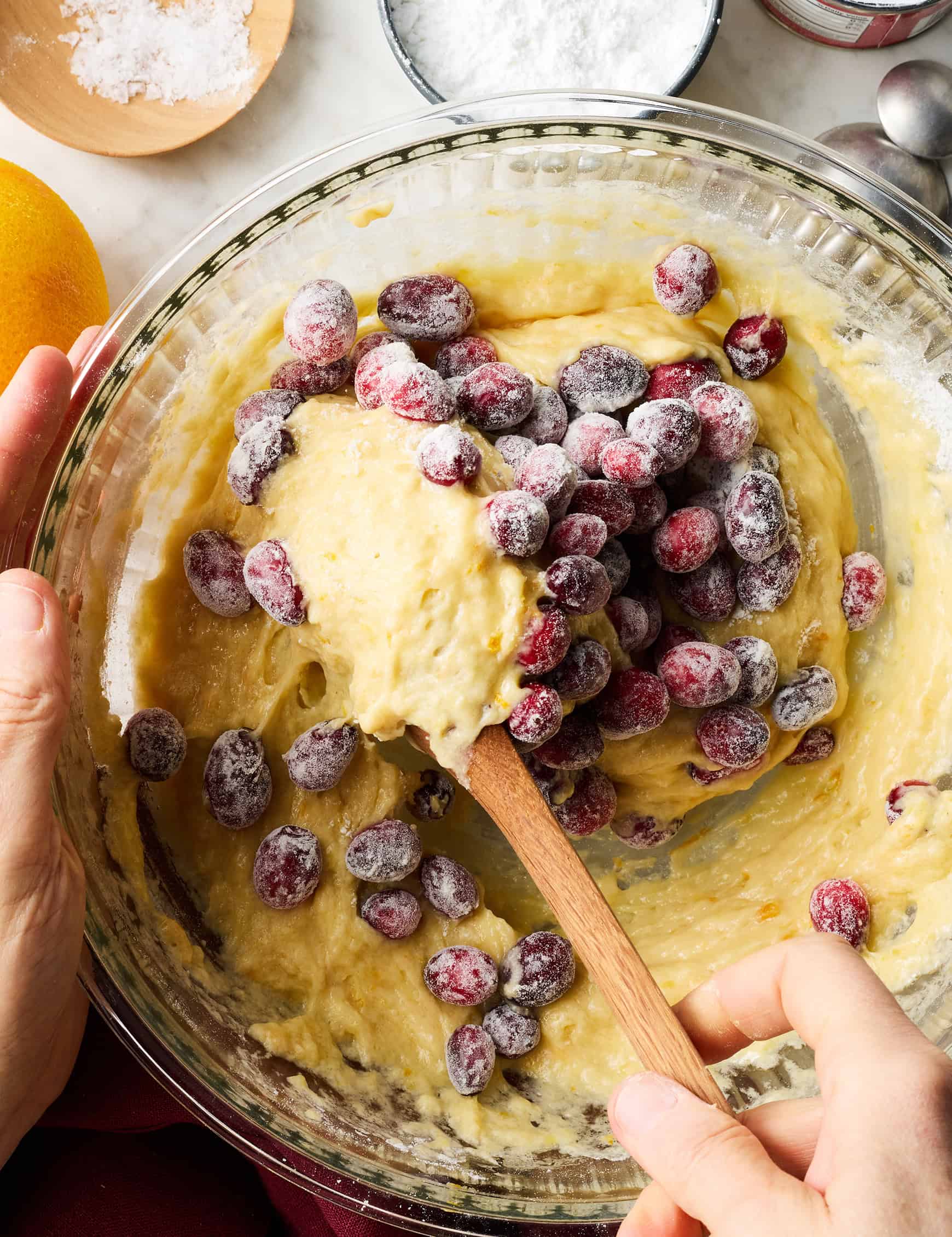 Folding cranberries into quick bread batter