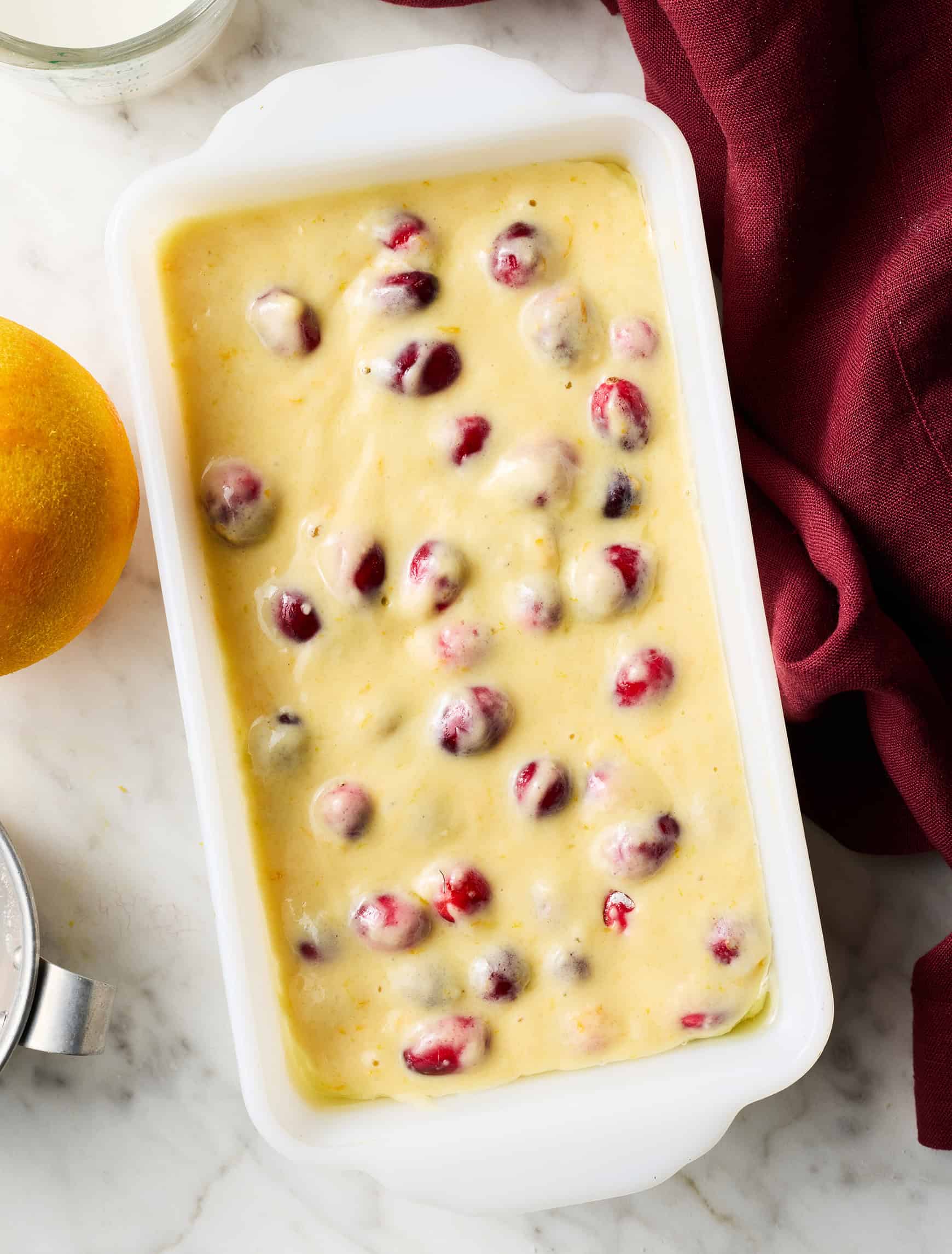 Cranberry orange bread batter in loaf pan