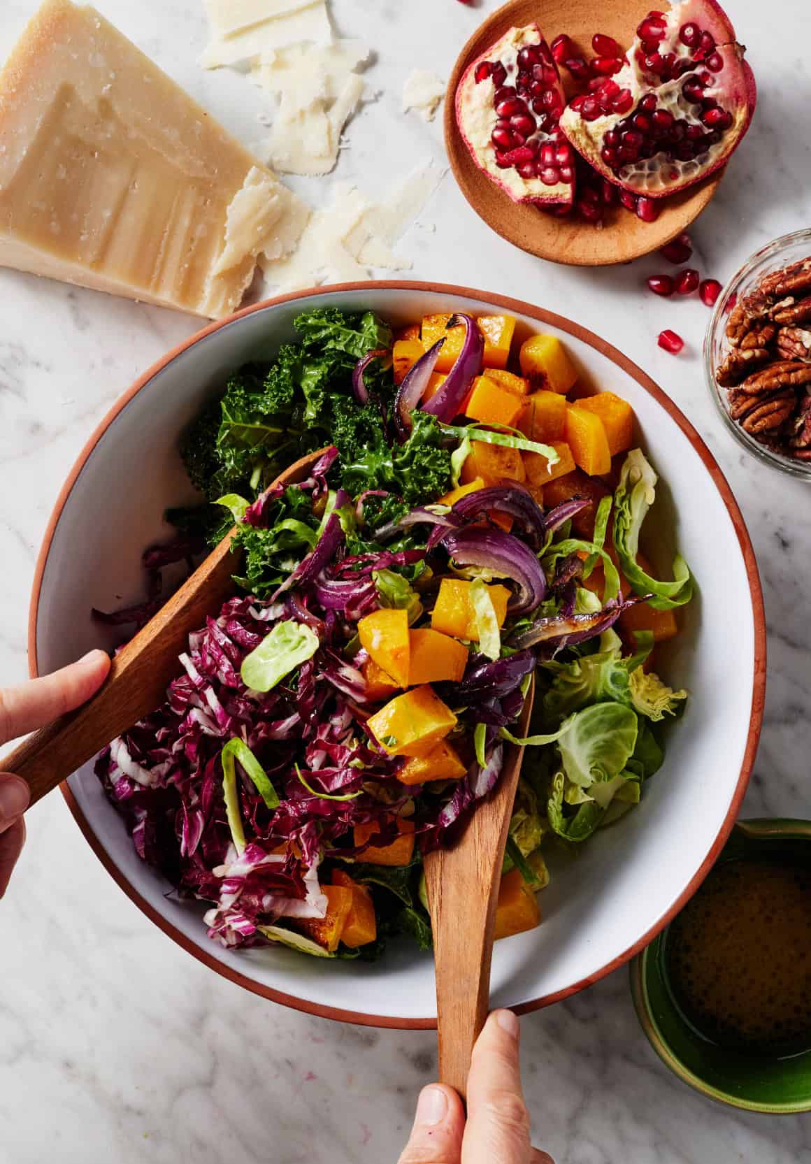 Tossing Christmas salad in large bowl