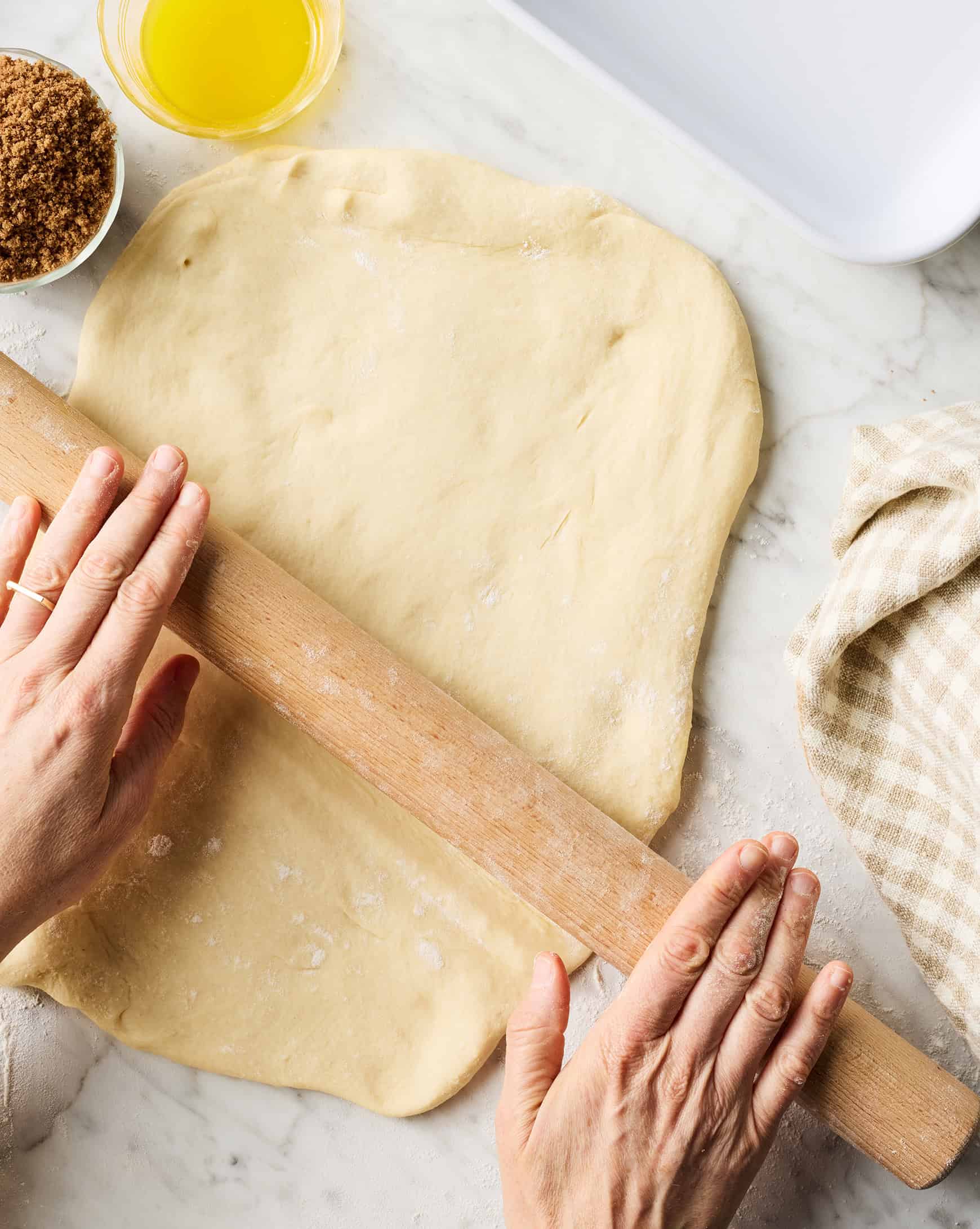 Rolling out cinnamon roll dough