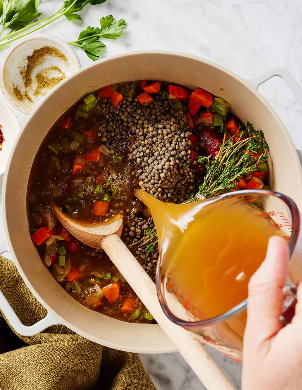 How to make lentil soup - pouring broth into pot
