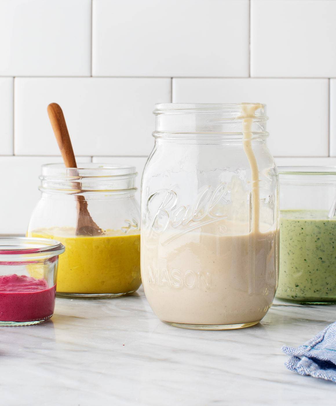 vegan meal prep ideas - 4 jars of tahini sauce